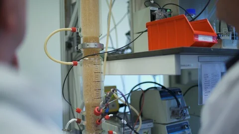 Lab technicians testing water at a water treatment facility. Stock Footage 129761188