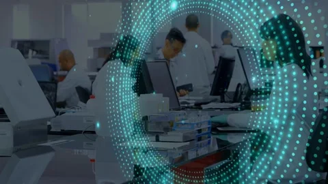 Lab technicians typing and sorting trays while turquoise dot ring appearing and Stock Footage 332955934