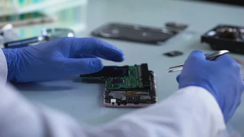 Lab worker analyzing computer part, forensic science experiment, information Stock-Footage 88198086