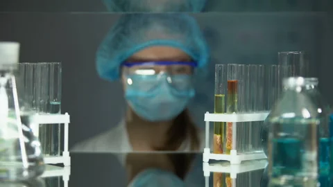 Lab worker analyzing meat sample in tube and adding chemical agent, parasites Stock Footage 104989107