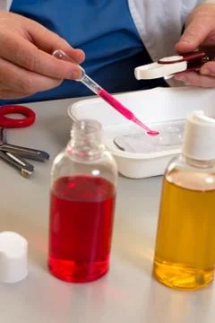 Lab worker doing tests closeup Stock Photos