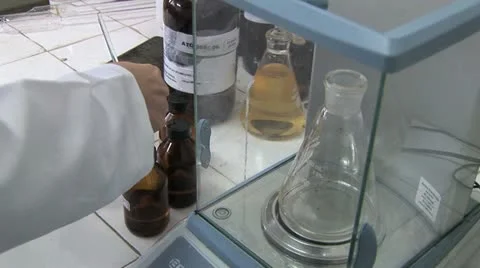 Lab Worker Pours A Liquid Into A Carafe 2 Stock Footage 20441782