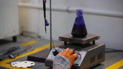 Lab worker s checking the temperature of casting chemicals  Video stock 305996366