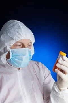 Lab worker testing a sample Stock Photos