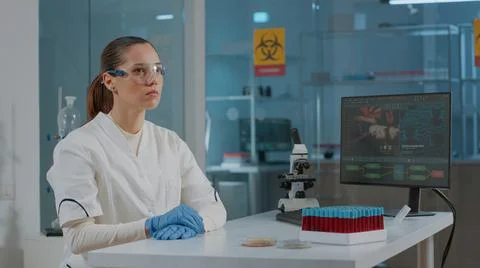Lab worker using glasses with virtual reality to develop experiment Stock Photos