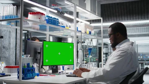 Lab worker using isolated screen computer for DNA data analysis Stock Footage 320143979