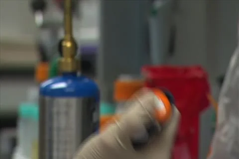 Lab worker using a plundger Stock Footage 11351212