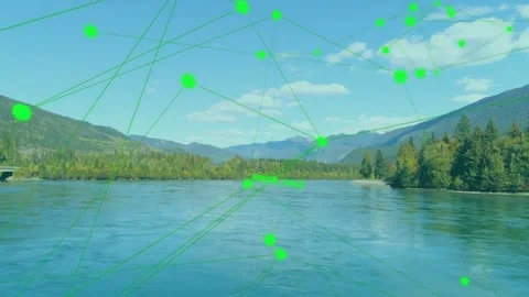Label appearing near horizon causing neon nodes forming web over lake and ridge Video stock 334352083