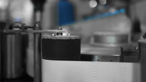 Label is applied by a roller on a plastic bottle with water water bottling plant Stock Footage 162974602