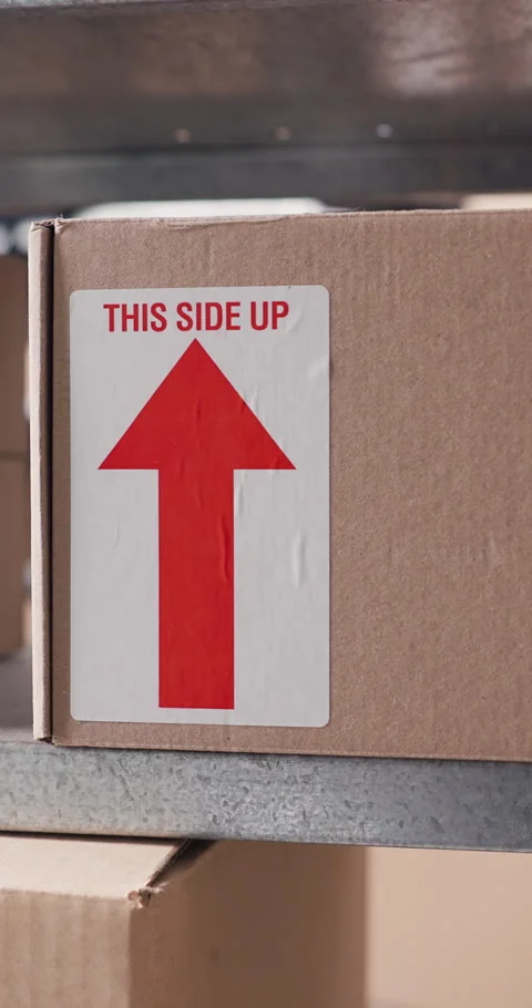 Label, arrow and stock with box on shelf in storage depot for delivery Stock Footage 332321609