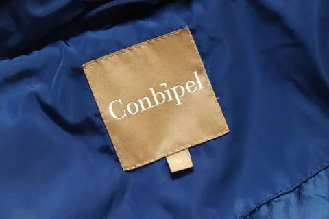 Label of a CONBIPEL jacket. Conbipel is an Italian fashion brand of clothing	 Stock Photos
