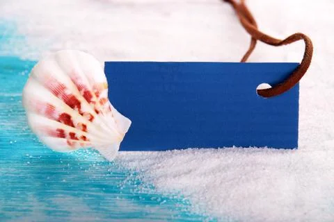 Label with Copyspace and a Shell, on the Beach Stock Photos