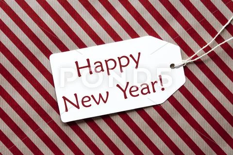 Label On Red Wrapping Paper, Text Happy New Year Stock Photos