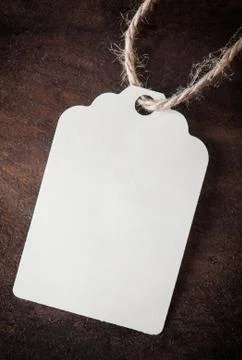Label on a wooden beige background Stock Photos