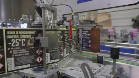 Labeling Machine Applying Coolant Labels Bottles Conveyor Stock Footage 335980946