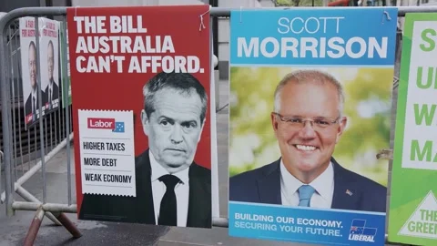 Labor and Liberal campaign posters outside the overseas polling place in London Stock Footage 345298804