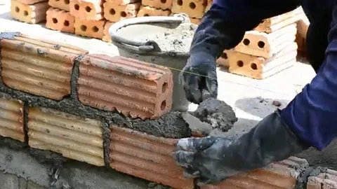 Labor build brick in construction site Stock Footage 98247925