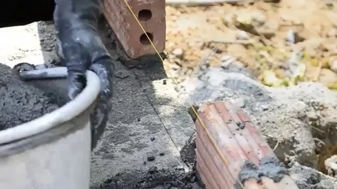 Labor build brick in construction site Stock Footage 98247928