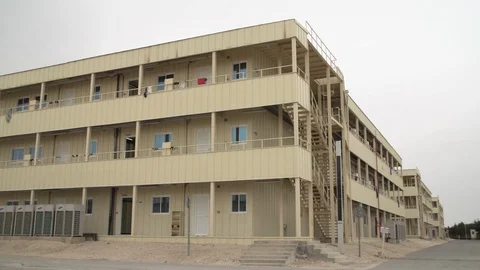 Labor camp for Asian workers during the construction boom in Qatar Stock Footage 105912594