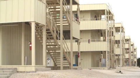 Labor camp for Asian workers during the construction boom in Qatar Stock Footage 105914296
