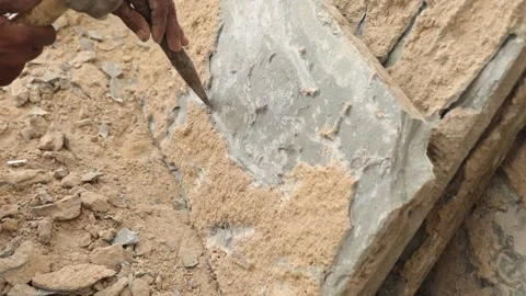 The labor cleaning marble tile and renovating the floor using hammer and chisel. Stock Footage 245100752