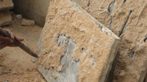 The labor cleaning marble tile and renovating the floor using hammer and chisel. Stock Footage 245100853