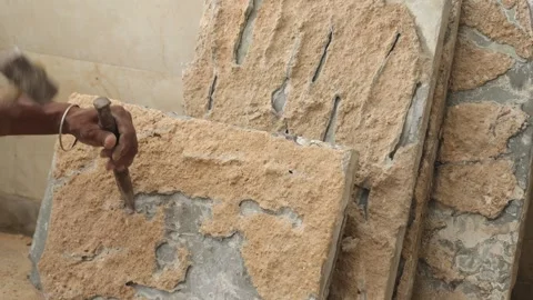 The labor cleaning marble tile and renovating the floor using hammer and chisel. Stock Footage 245100856