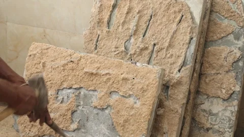 The labor cleaning marble tile and renovating the floor using hammer and chisel. Stock Footage 245100870