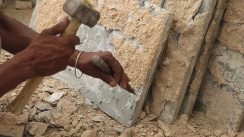 The labor cleaning marble tile and renovating the floor using hammer and chisel. Stock Footage 245100990
