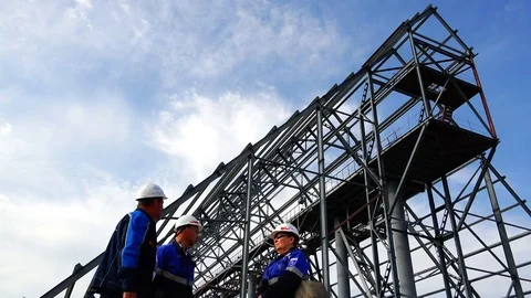 Labor inspectorate for construction supervision on the background of metal Stock Footage 73814147