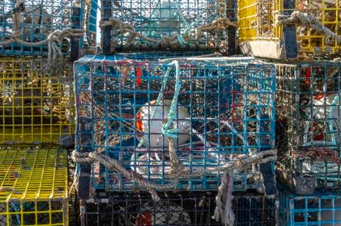 Labor-intensive preparation obvious in stack of lobster traps Stock Photos