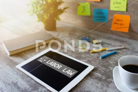 Labor law icon and text on device screen. Stock Photos