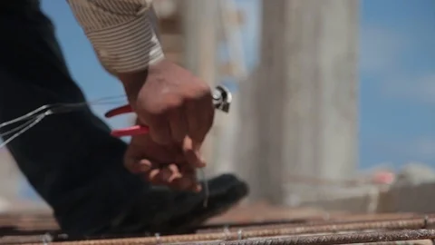 Labor Man Hands Attaching metallic wires in a construction site Stock Footage 127127688