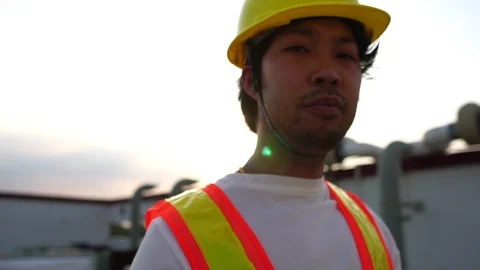 Labor man holding a pipe wrench with the warm light of the Sunset Stock Footage 105913113