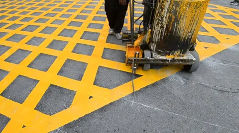 Labor use small machine paint line on road Stock Footage 31122838