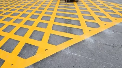 Labor use small machine paint line on road Stock Footage 98247937