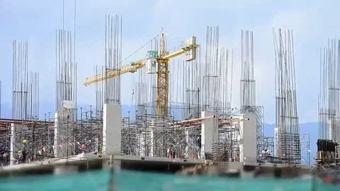 Labor working in big construction site Stock Footage 98247939