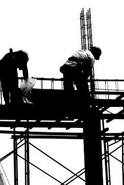 Labor working in construction site Photos