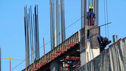 Labor working on construction site. Stock Photos