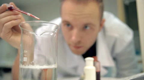 The laboratorian is adding an ingredient into personal care means Stock Footage 59108684