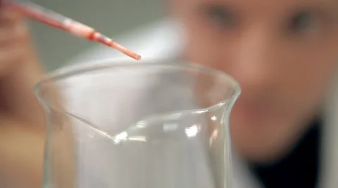 The laboratorian is adding an ingredient into personal care means Stock Footage 59108722