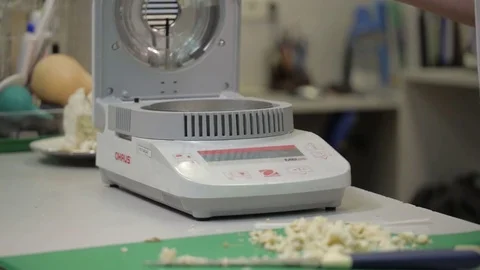 Laboratory analysis of cake on laboratory scales, laboratory equipment Stock Footage 75388939