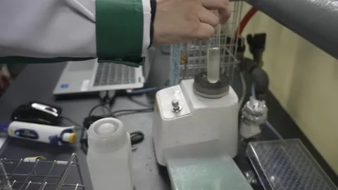 Laboratory Analysis of Sake With a Test Tube and Laptop Vídeos de archivo 340010517
