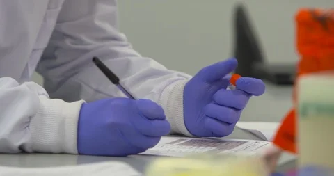 Laboratory analyst technician task report paperwork Stock Footage 100571042