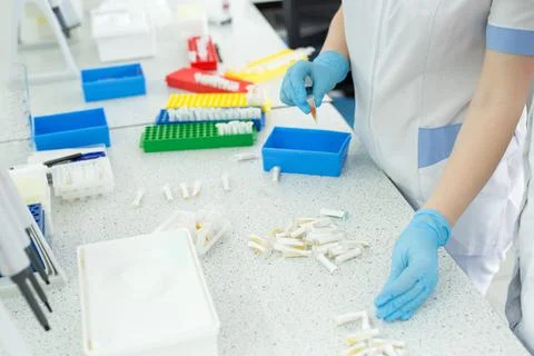 Laboratory assistant analyzing a blood sample. Medicine and science background Stock Photos