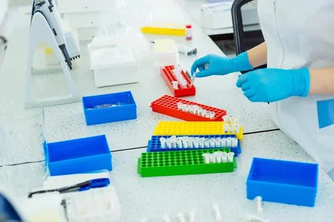 Laboratory assistant analyzing a blood sample. Medicine and science background Stock Photos