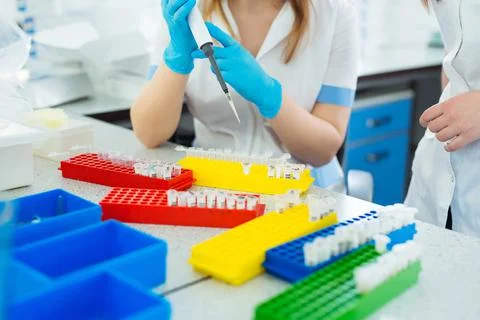 Laboratory assistant analyzing a blood sample. Medicine and science background Stock Photos