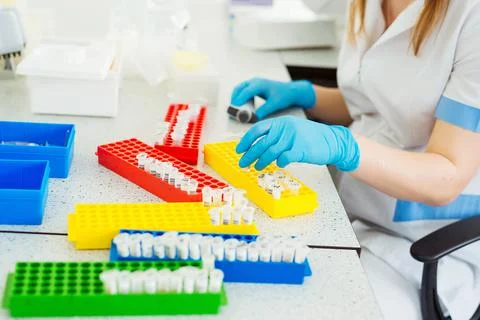 Laboratory assistant analyzing a blood sample. Medicine and science background Stock Photos