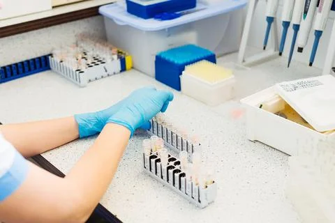 Laboratory assistant analyzing a blood sample. Medicine and science background Stock Photos