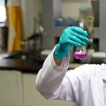 Laboratory assistant analyzing a liquid 스톡 사진